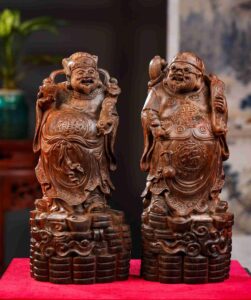 Tượng Thần Tài và Thương Gia